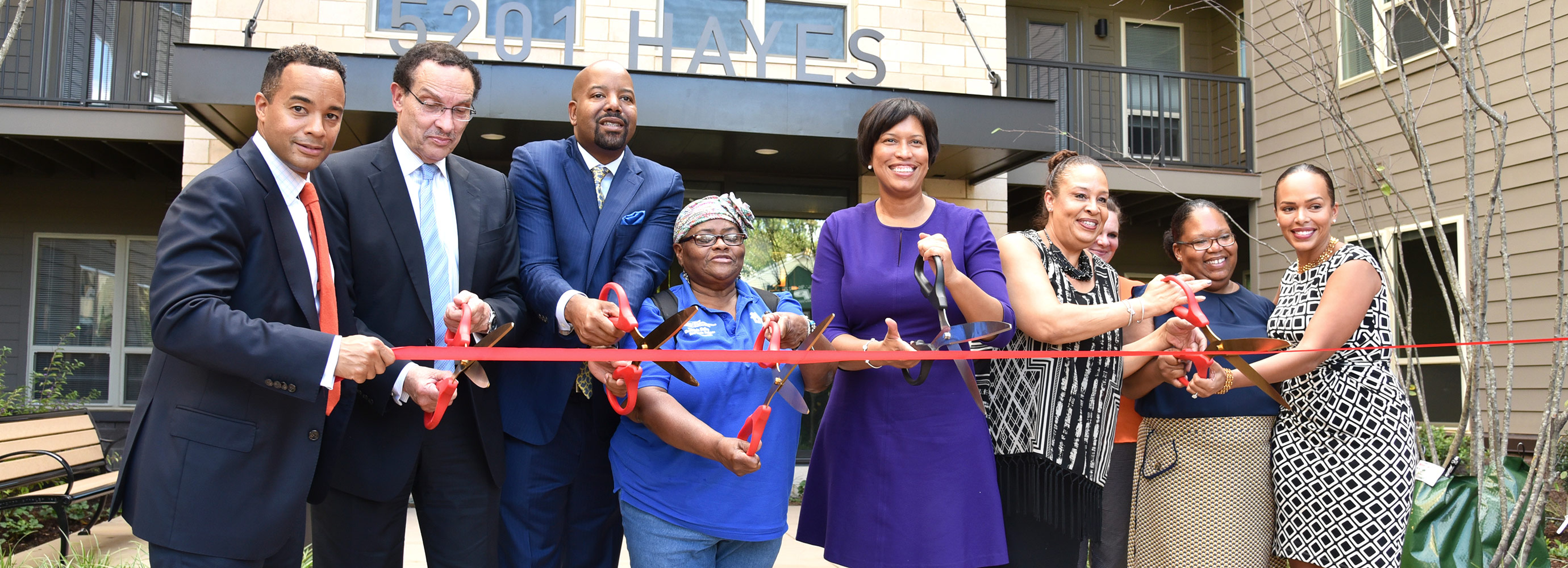 Ribbon cutting in front of 5201 HAYES