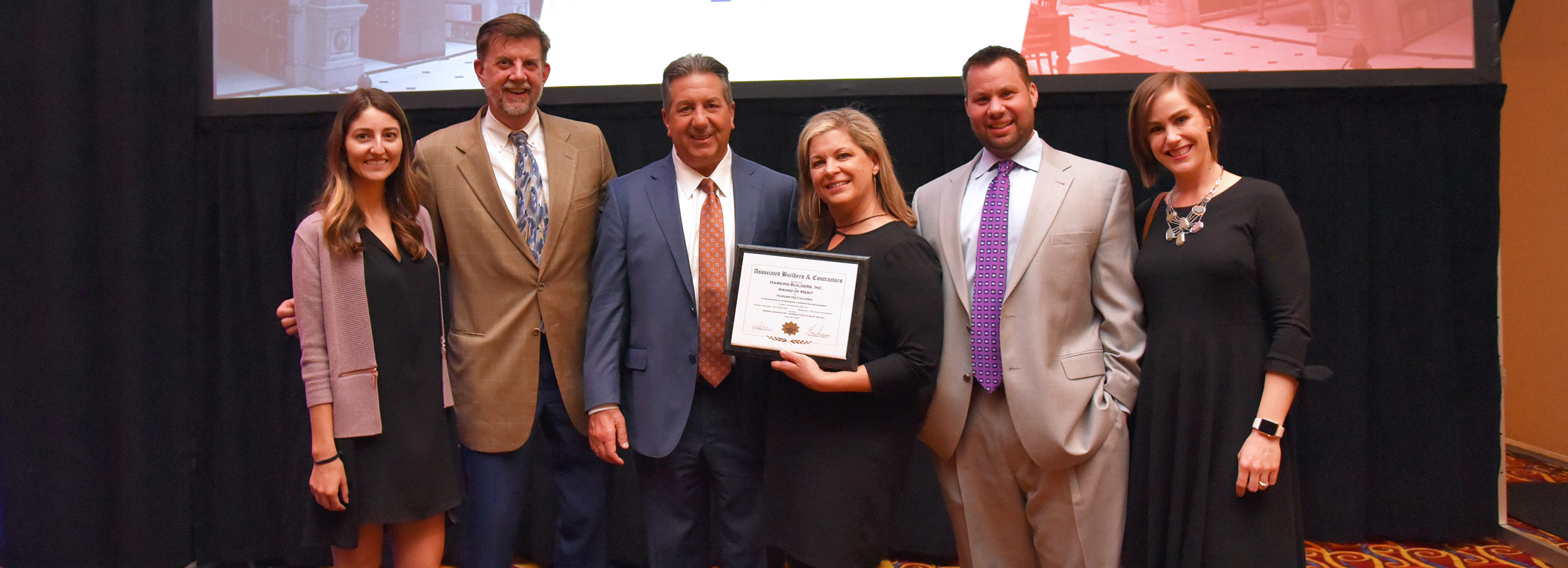 Harkins accepting award of Merit for HQ office