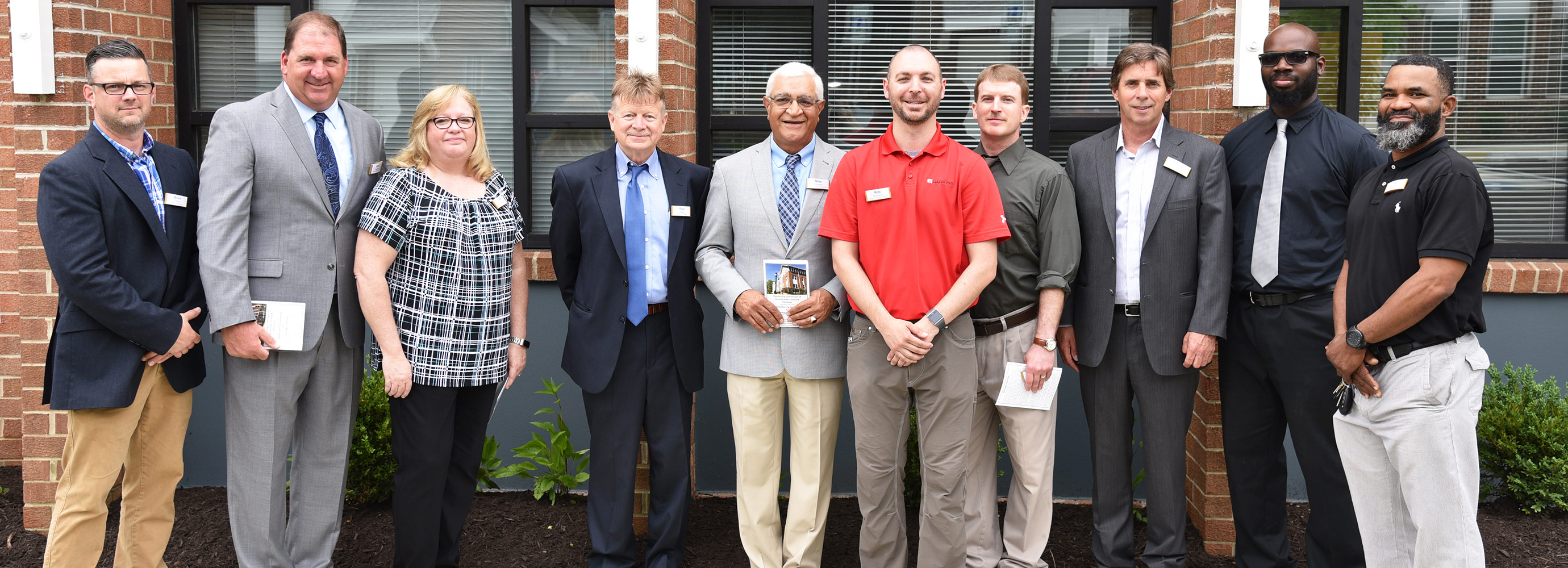 Team celebrating final phase of Heritage Overlook redevelopment