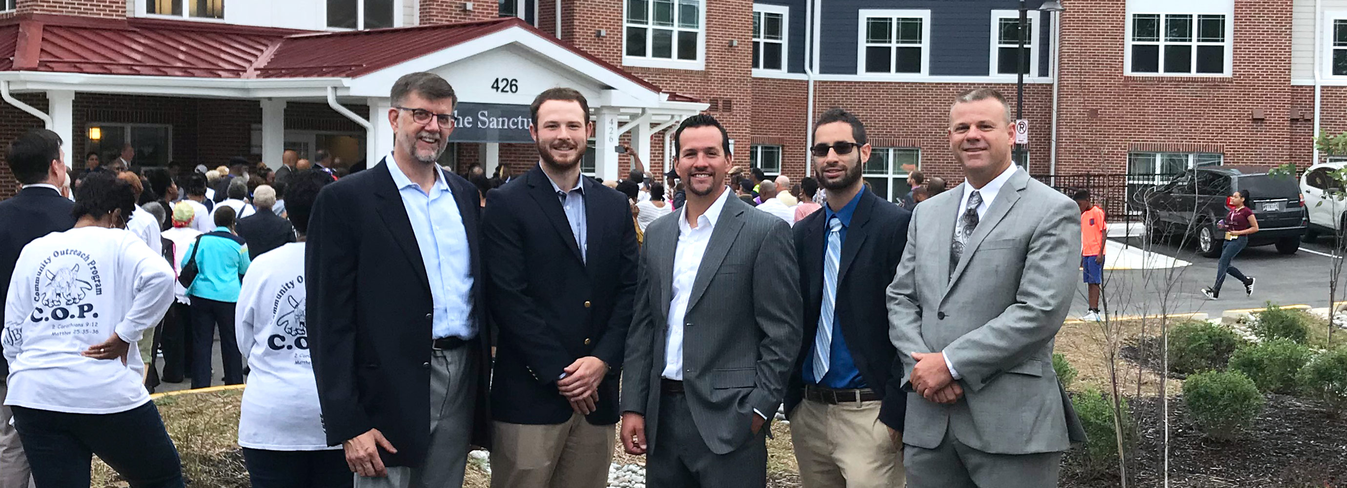 Harkins team members in front of Mt. Jezreel project celebrating grand opening