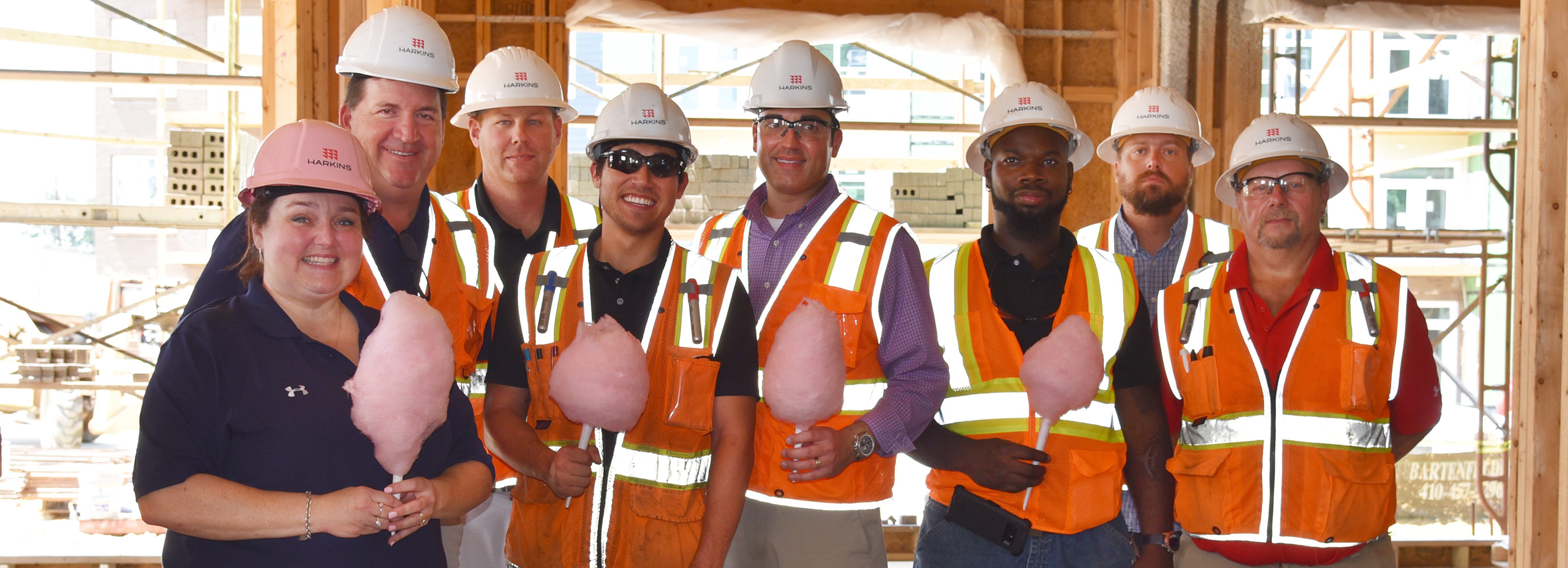 Group happy and celebrating with cotton candy at groundbreaking