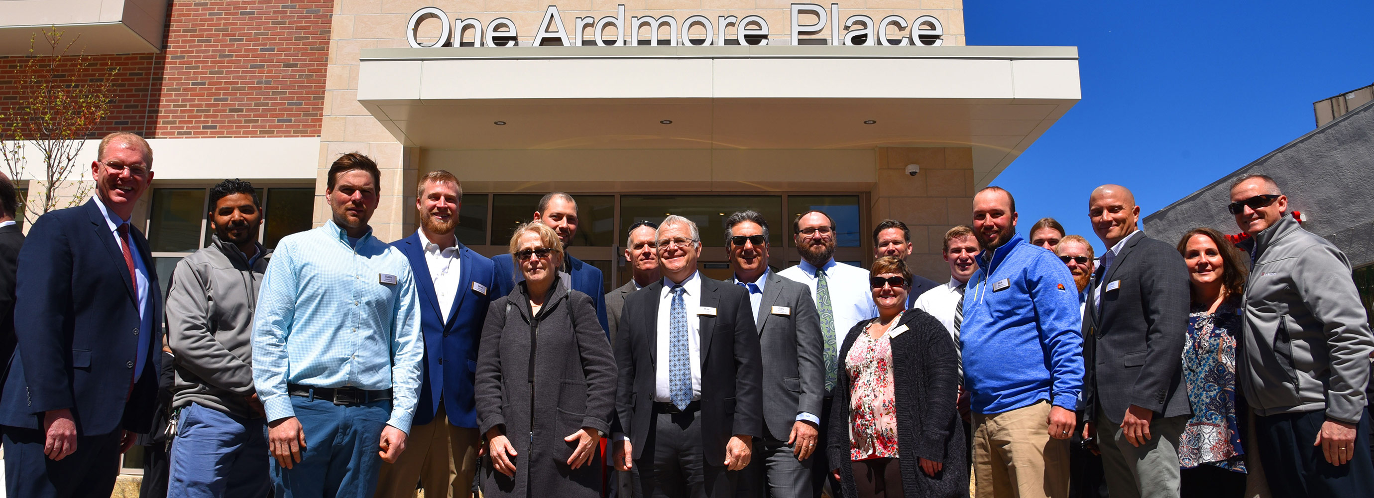 Construction team photo ribbon cutting