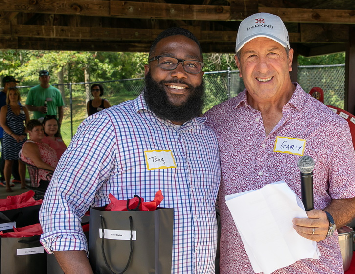 Two men smiling at camera