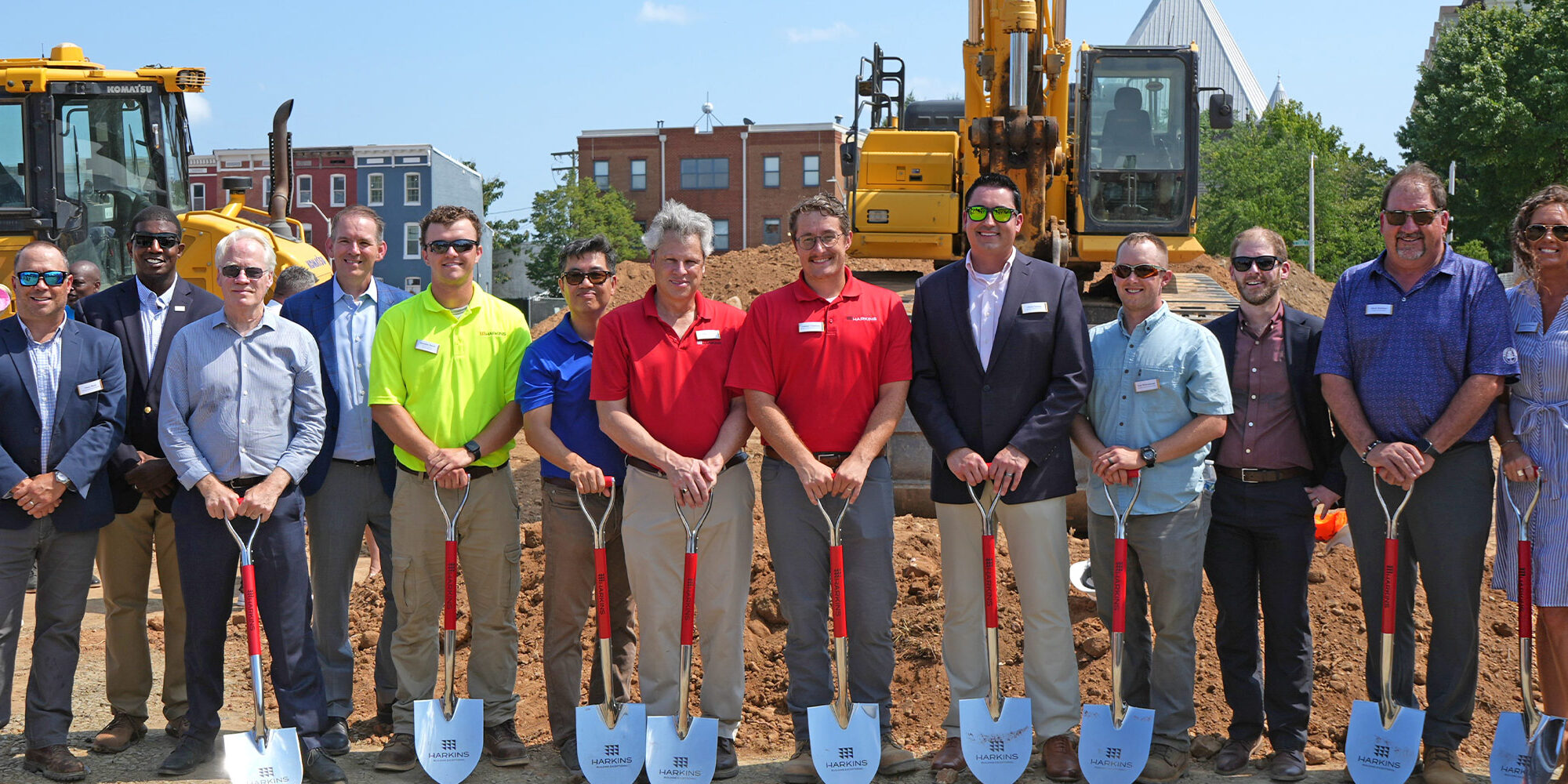 group photo holding shovels